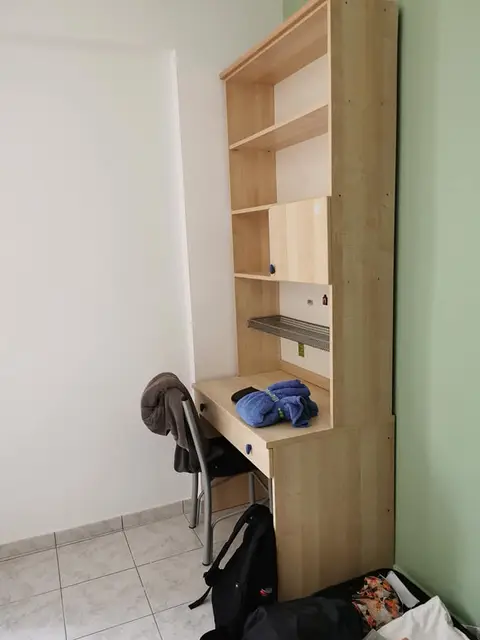 The ground-floor one-bedroom: the desk with its shelves