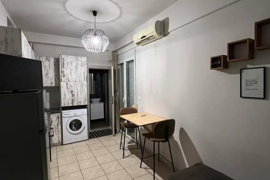A bright furnished living room in one of the homie hub apartments in Heraklion
