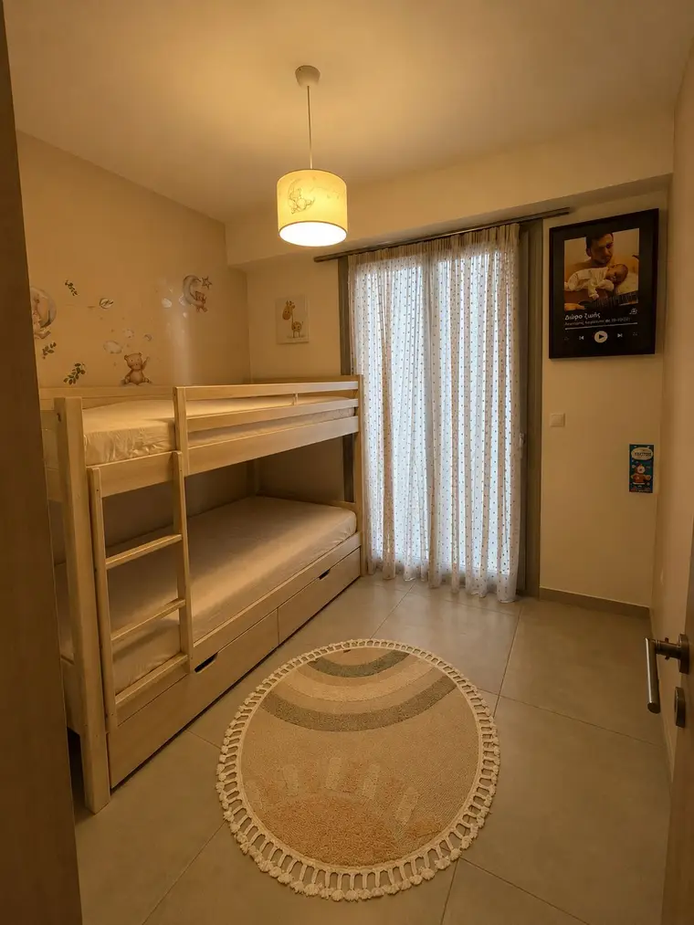 The renovated three-bedroom: a bedroom with a wooden bunk bed